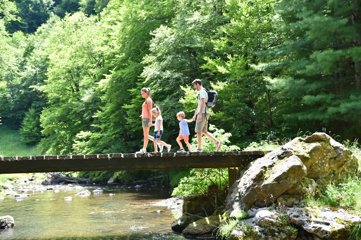 Family walking on a bridge together
